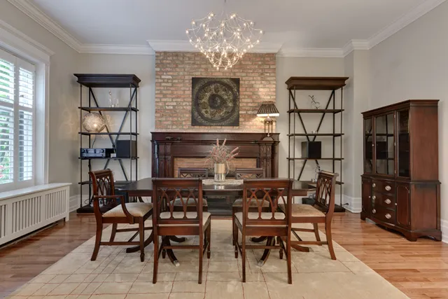 a view of a dining room with furniture and chandelier
