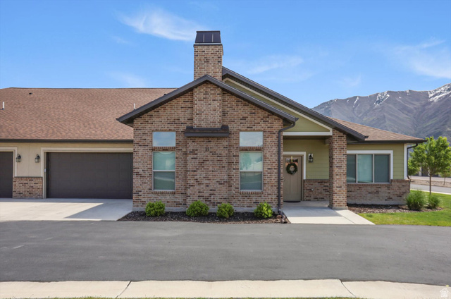 Brick facade entry with a prominent chimney feature