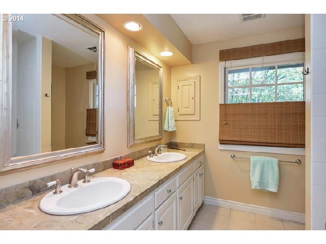 3700 Southwest 48th Place Portland, OR 97221 - Photo 8 of 16 a bathroom with a sink double vanity and a mirror