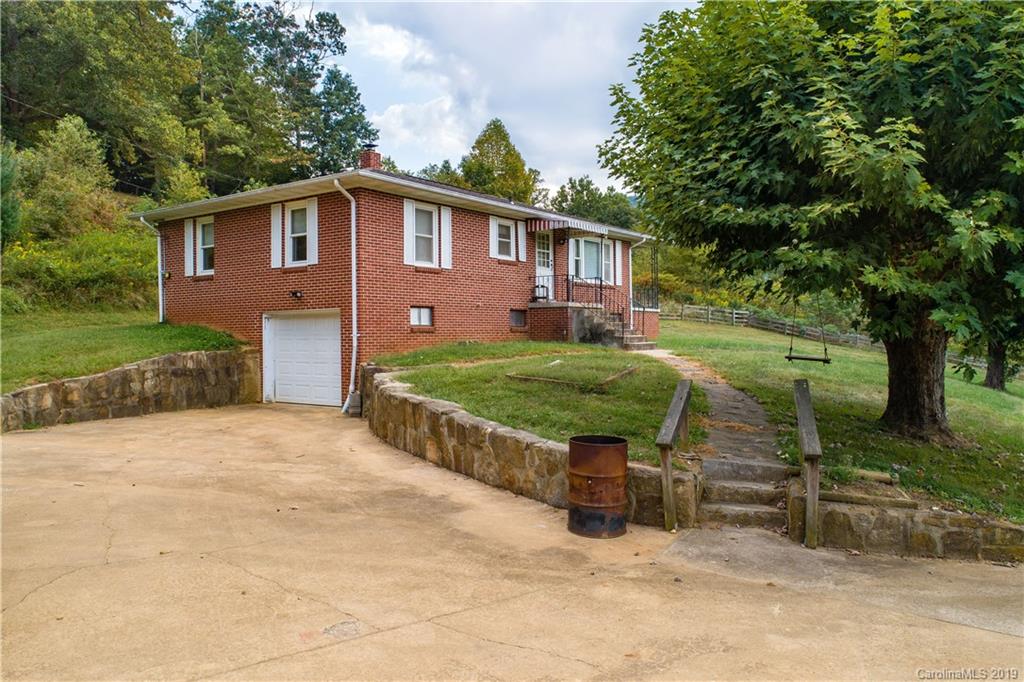 8617 Cruso Road Canton, NC 28716 - Photo 2 of 30 a view of a house with a yard