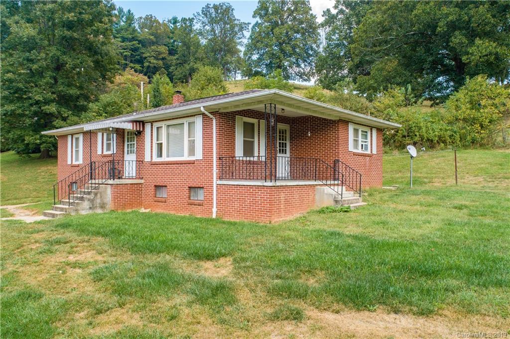 8617 Cruso Road Canton, NC 28716 - Photo 12 of 30 a front view of a house with a garden