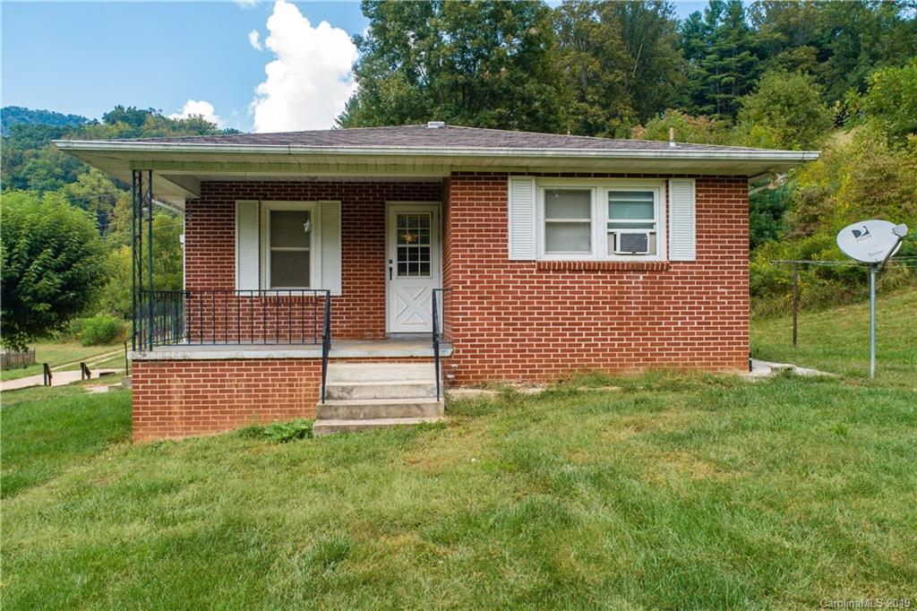 8617 Cruso Road Canton, NC 28716 - Photo 14 of 30 a front view of a house with a garden