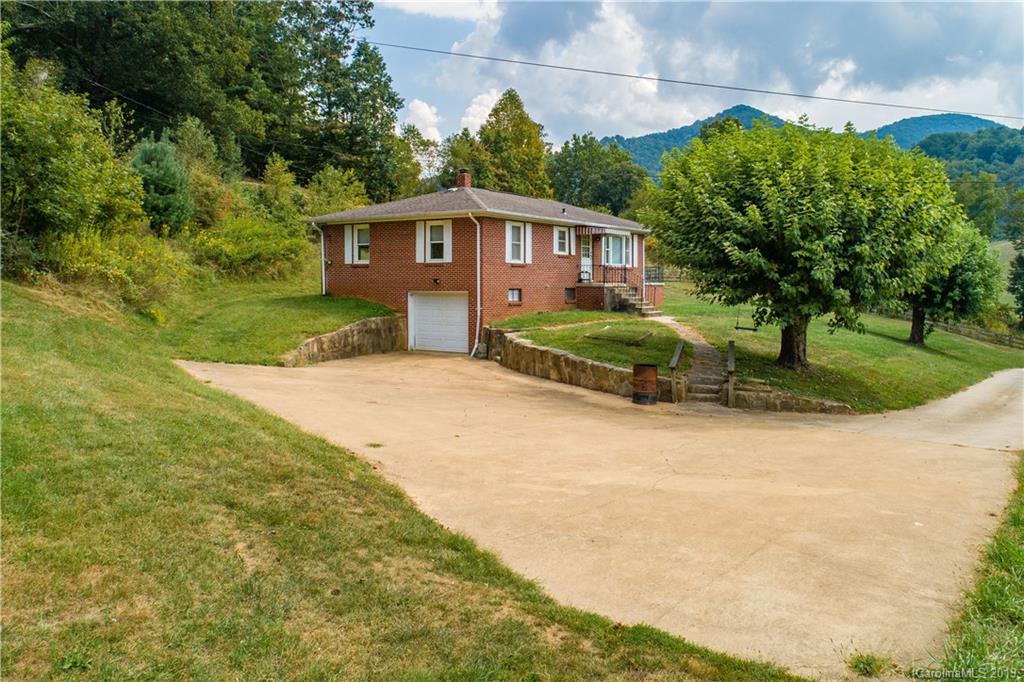 8617 Cruso Road Canton, NC 28716 - Photo 17 of 30 a front view of a house with a yard