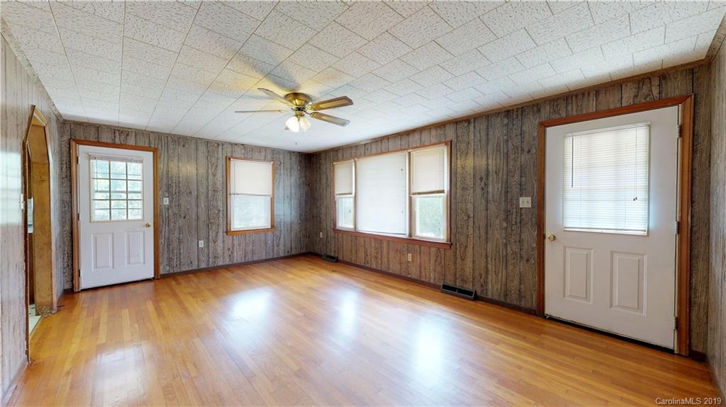 8617 Cruso Road Canton, NC 28716 - Photo 20 of 30 an empty room with wooden floor and windows