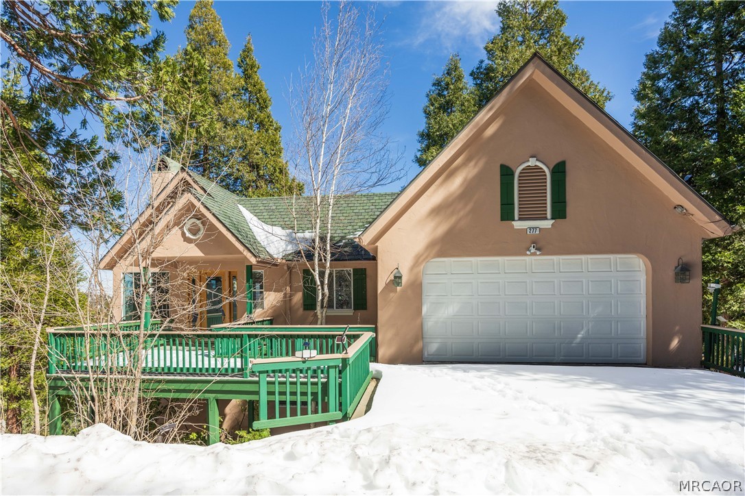 277 Grizzly Road Lake Arrowhead, CA 92352 - Photo 1 of 33 a front view of a house with a garden and plants
