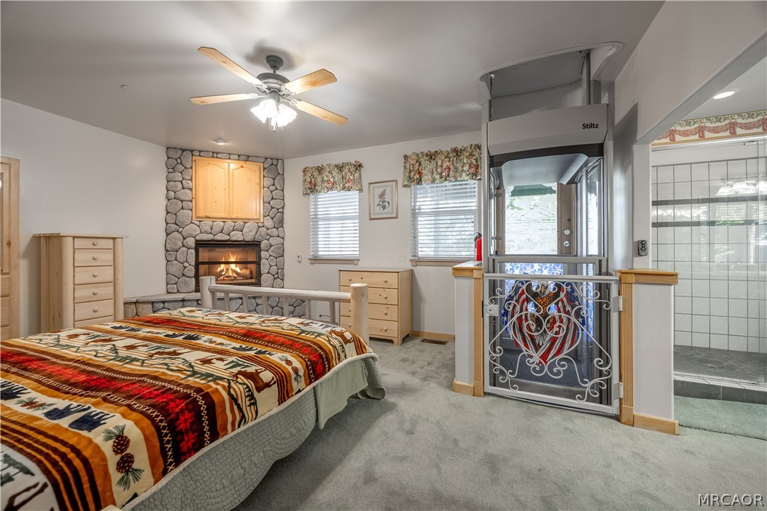 277 Grizzly Road Lake Arrowhead, CA 92352 - Photo 16 of 33 a bed room with a bed and a table