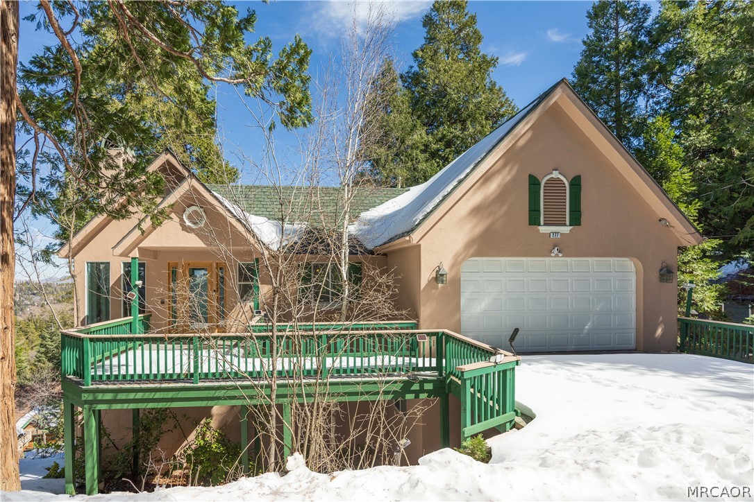 277 Grizzly Road Lake Arrowhead, CA 92352 - Photo 32 of 33 a front view of a house with a garden and plants