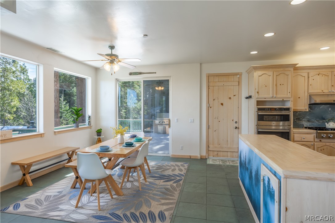 277 Grizzly Road Lake Arrowhead, CA 92352 - Photo 5 of 33 a dining room with furniture and a kitchen view
