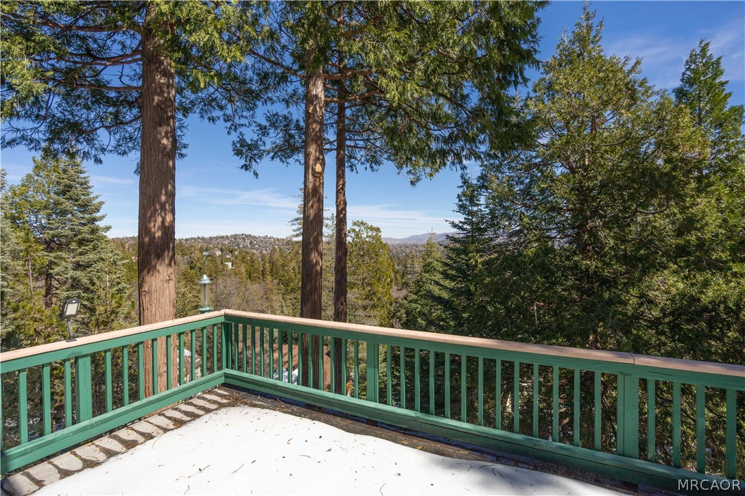 277 Grizzly Road Lake Arrowhead, CA 92352 - Photo 10 of 33 a balcony with trees in front of it