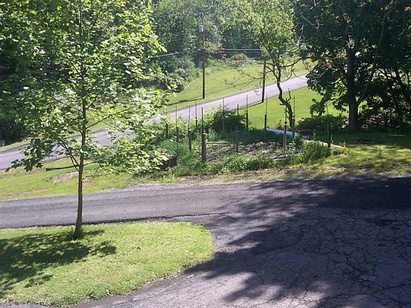 211 Weber Road Sewickley, PA 15143 - Photo 18 of 18 Exterior Front. Looking toward Weber Road and fenced garden plot.