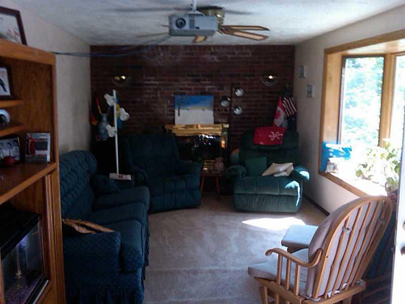 211 Weber Road Sewickley, PA 15143 - Photo 3 of 18 Living Room. The fireplace was originally log burning, presently has gas logs but no gas source. Appealing bay window.