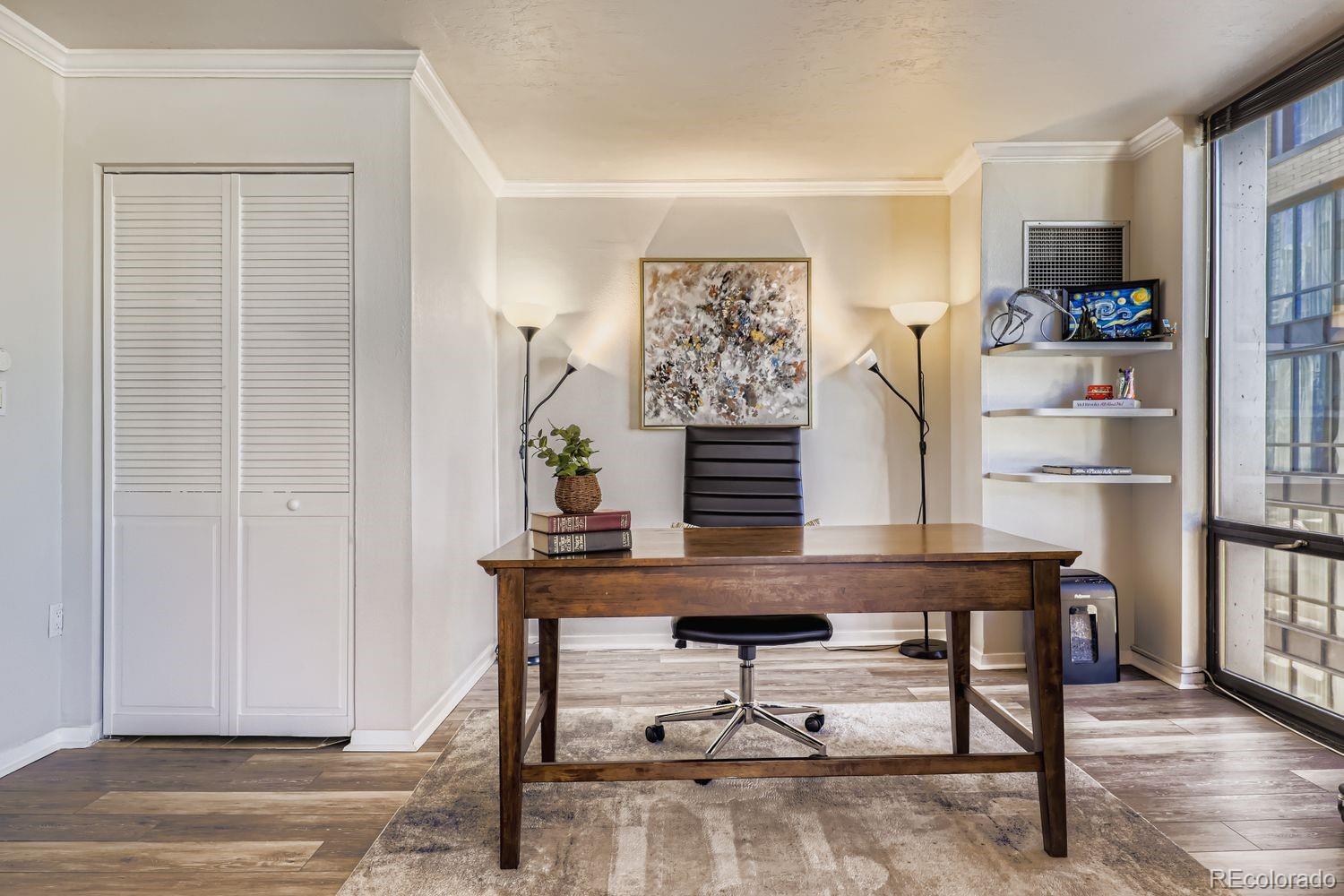 1625 Larimer Street, Unit 1007 Denver, CO 80202 - Photo 11 of 28 a view of a workspace with furniture and wooden floor