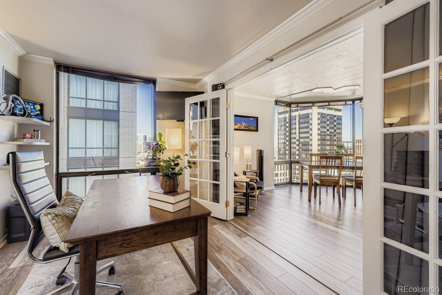 1625 Larimer Street, Unit 1007 Denver, CO 80202 - Photo 12 of 28 a view of a dining room with furniture and a table