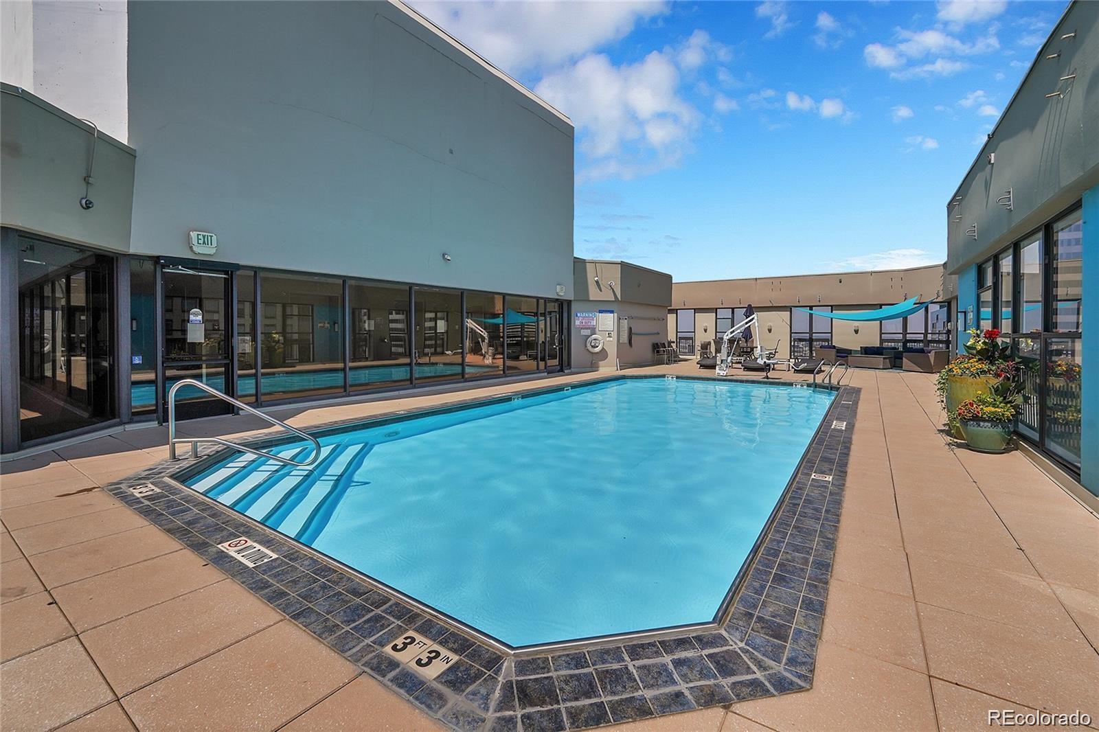 1625 Larimer Street, Unit 1007 Denver, CO 80202 - Photo 16 of 28 a swimming pool with outdoor seating