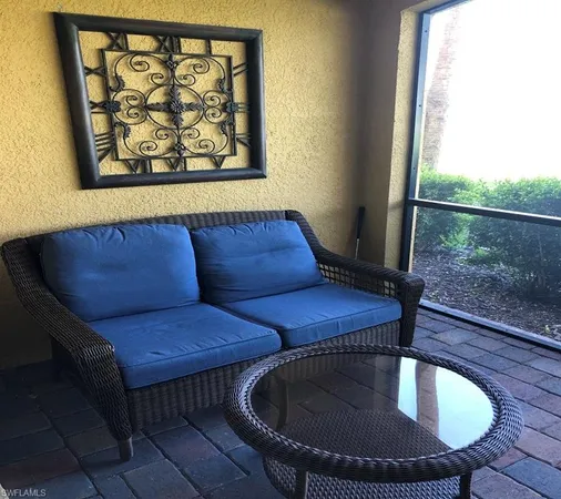 a living room with a couch and a table