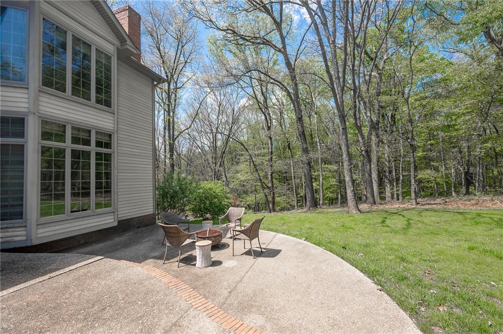 141 Timber Springs Drive Indiana, PA 15701 - Photo 12 of 50 a view of a backyard with sitting area and garden