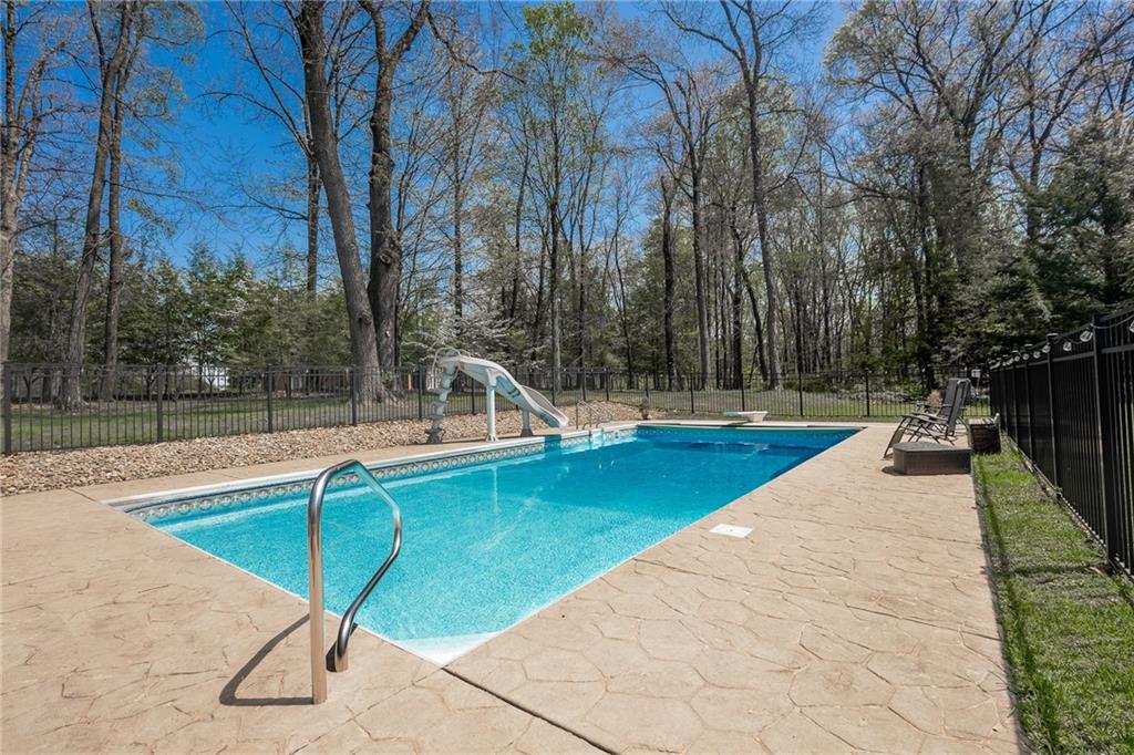 141 Timber Springs Drive Indiana, PA 15701 - Photo 18 of 50 a view of a swimming pool with a lounge chair