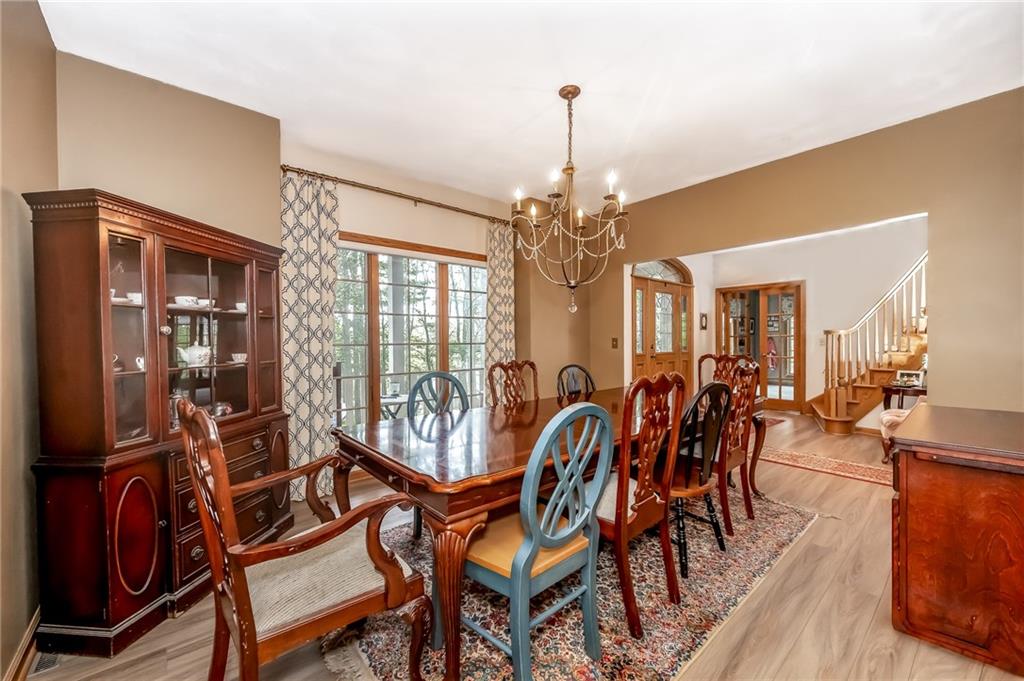 141 Timber Springs Drive Indiana, PA 15701 - Photo 34 of 50 a view of a dining room with furniture and wooden floor