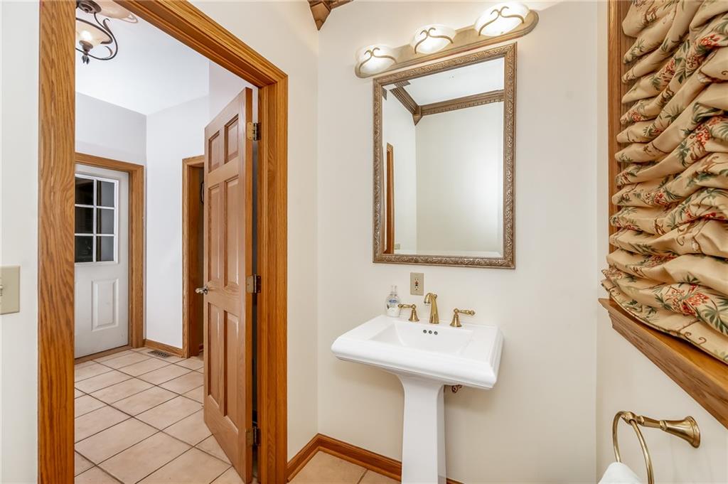 141 Timber Springs Drive Indiana, PA 15701 - Photo 35 of 50 a bathroom with a sink a mirror and a shower