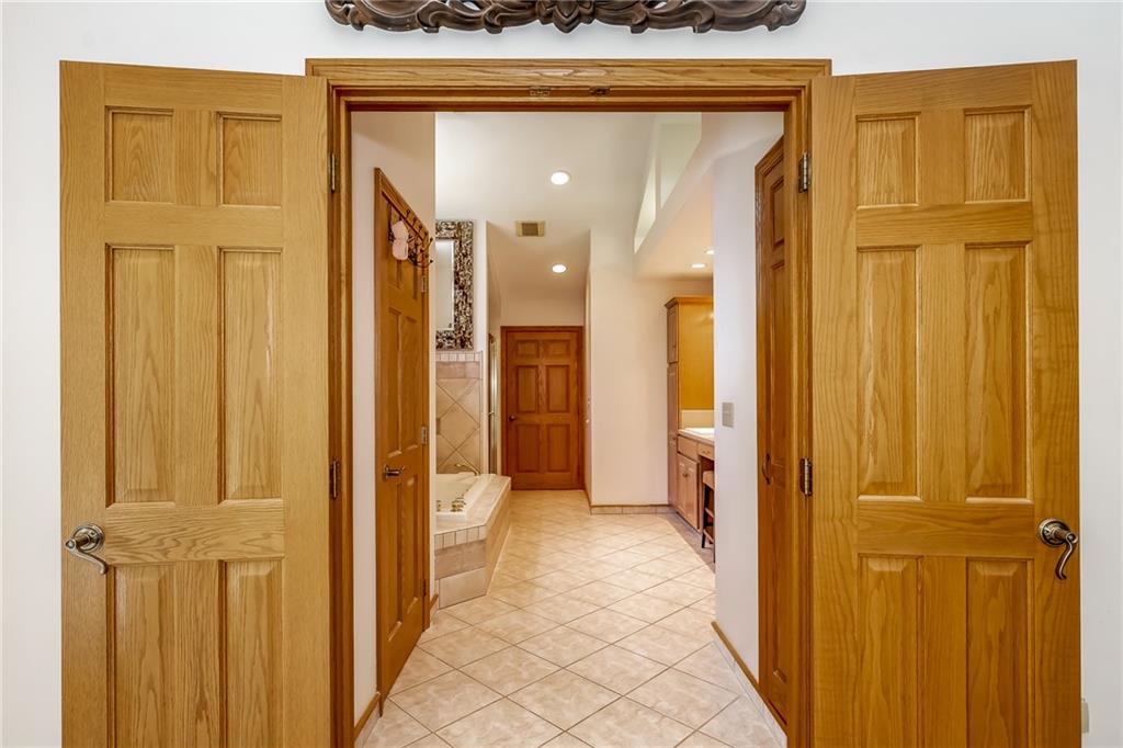 141 Timber Springs Drive Indiana, PA 15701 - Photo 39 of 50 a view of a hallway with wooden shelves