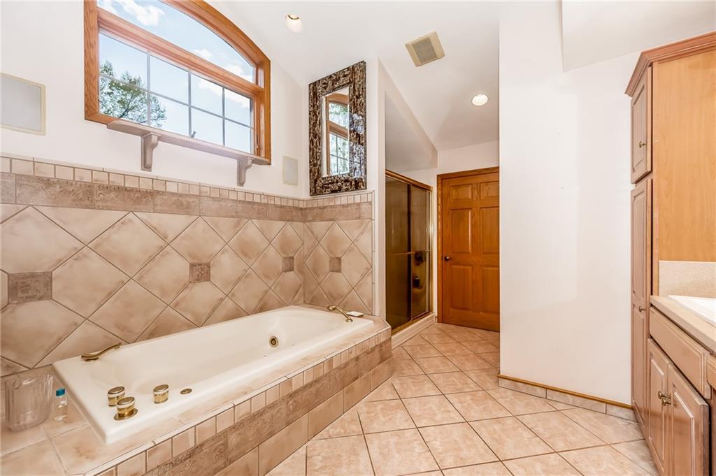 141 Timber Springs Drive Indiana, PA 15701 - Photo 40 of 50 a bathroom with a bathtub and a shower