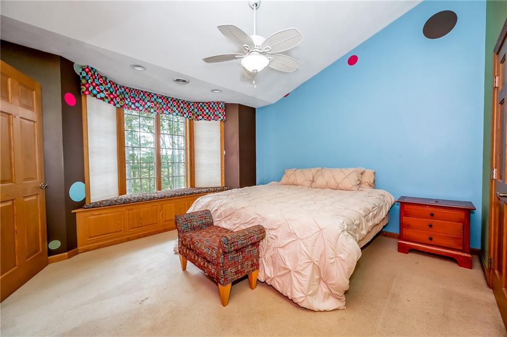 141 Timber Springs Drive Indiana, PA 15701 - Photo 42 of 50 a spacious bedroom with a bed and a chandelier