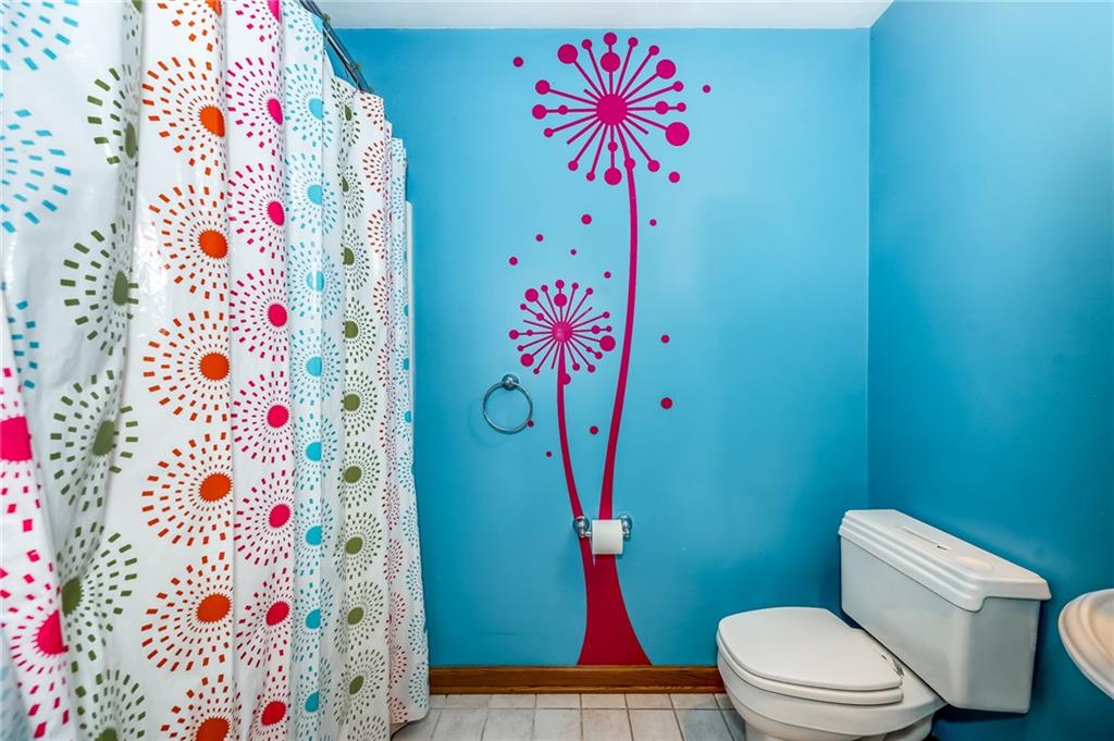 141 Timber Springs Drive Indiana, PA 15701 - Photo 43 of 50 a bathroom with a sink a toilet and a shower curtain