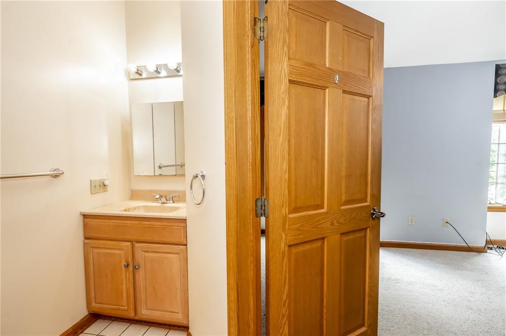 141 Timber Springs Drive Indiana, PA 15701 - Photo 46 of 50 a bathroom with a sink a mirror and a shower