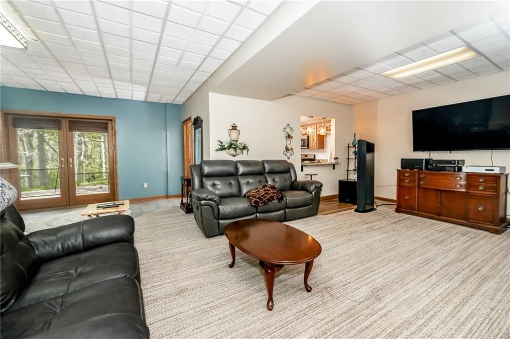 141 Timber Springs Drive Indiana, PA 15701 - Photo 48 of 50 a living room with furniture and a flat screen tv