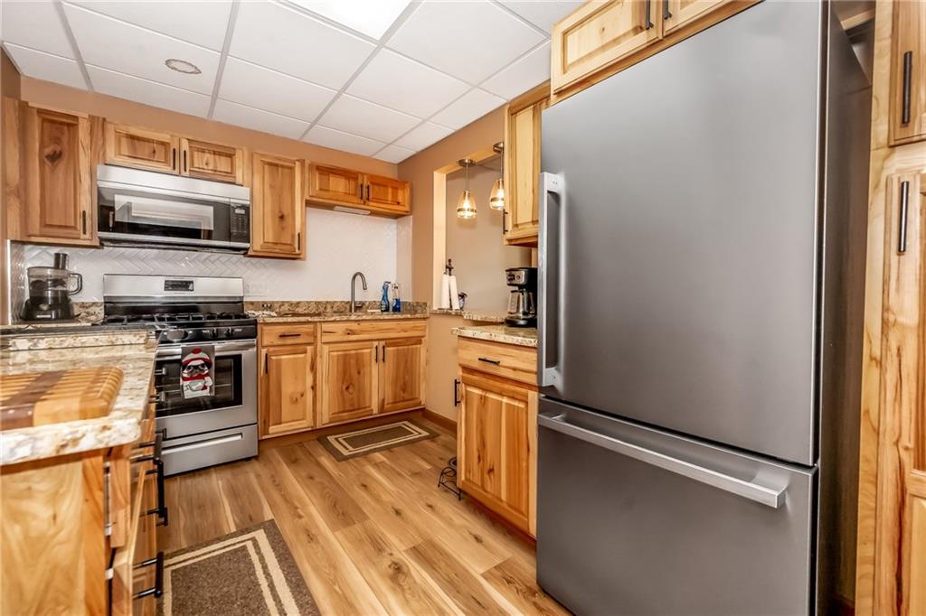 141 Timber Springs Drive Indiana, PA 15701 - Photo 49 of 50 a kitchen with stainless steel appliances a refrigerator and a stove top oven