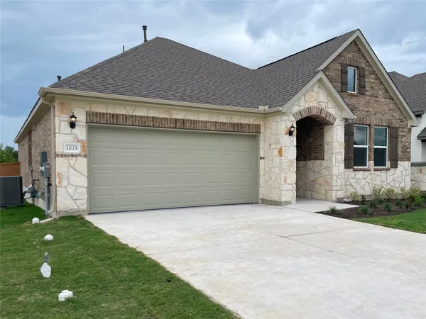 a front view of house with yard