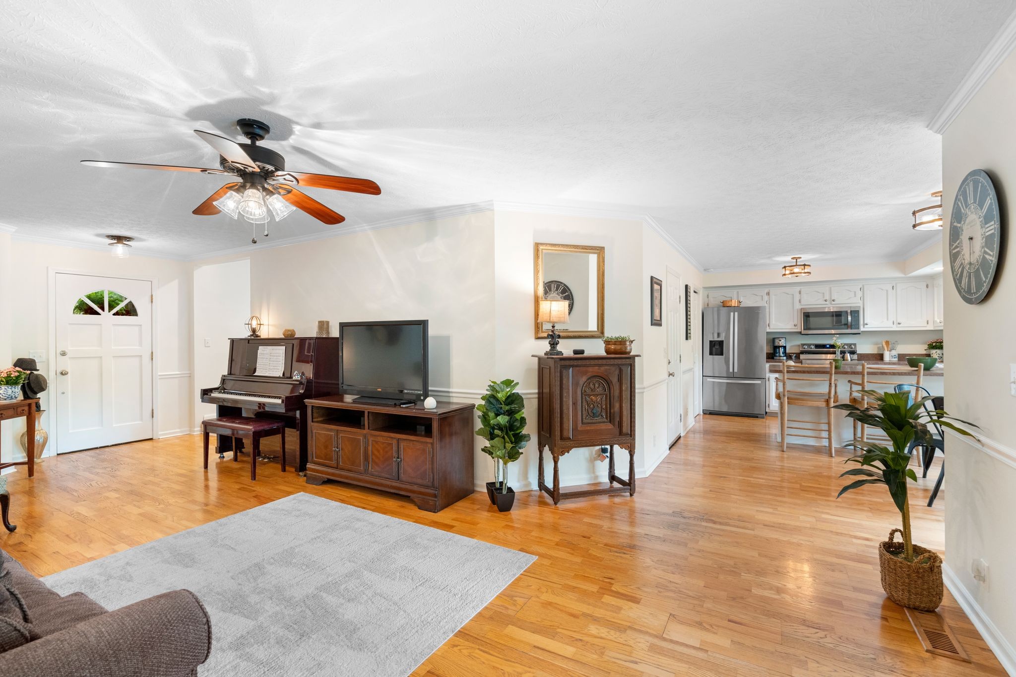 215 Devrow Court Franklin, TN 37064 - Photo 12 of 46 a living room with furniture kitchen view and a wooden floor