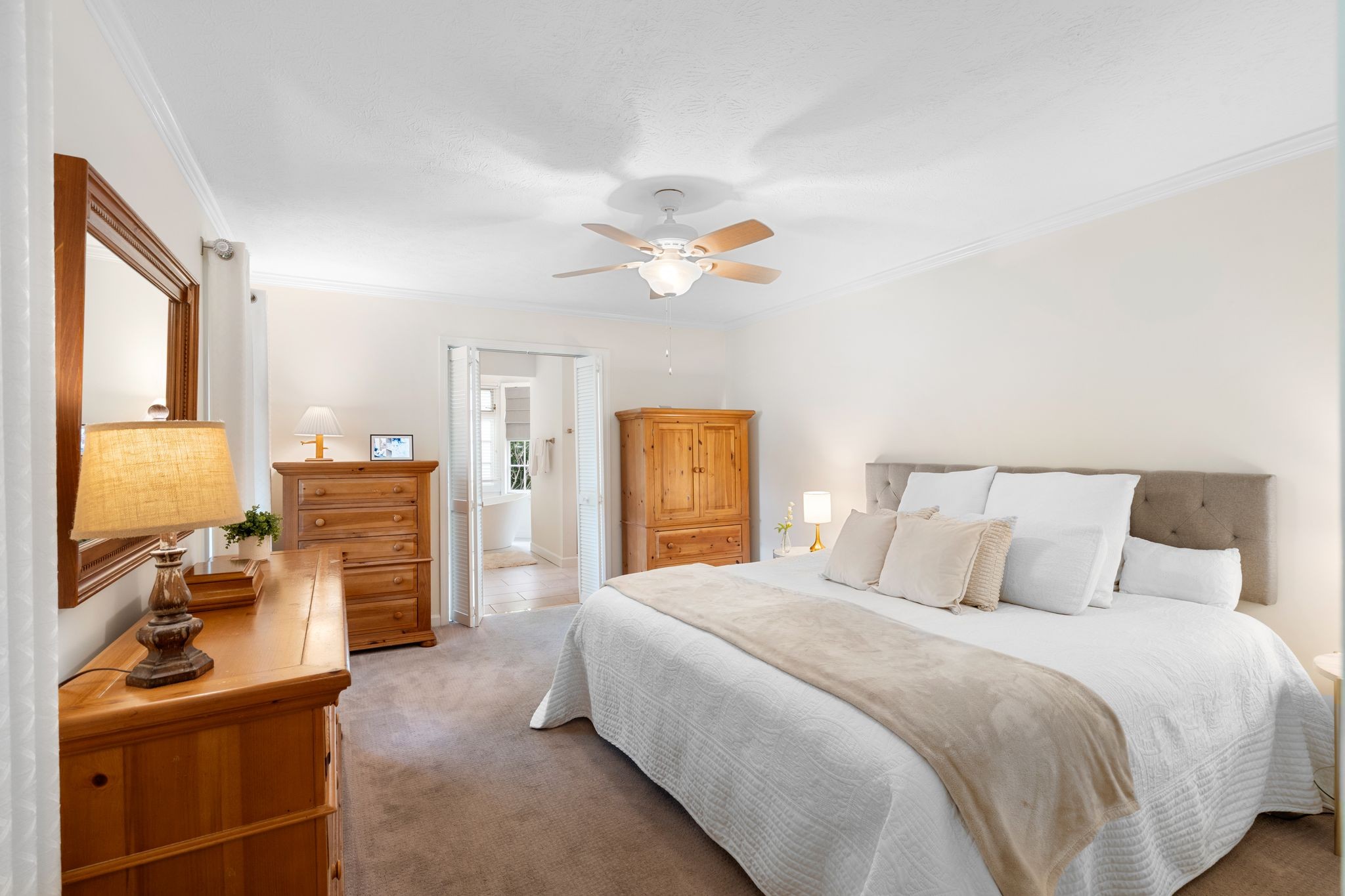 215 Devrow Court Franklin, TN 37064 - Photo 19 of 46 a bedroom with a bed and a chandelier