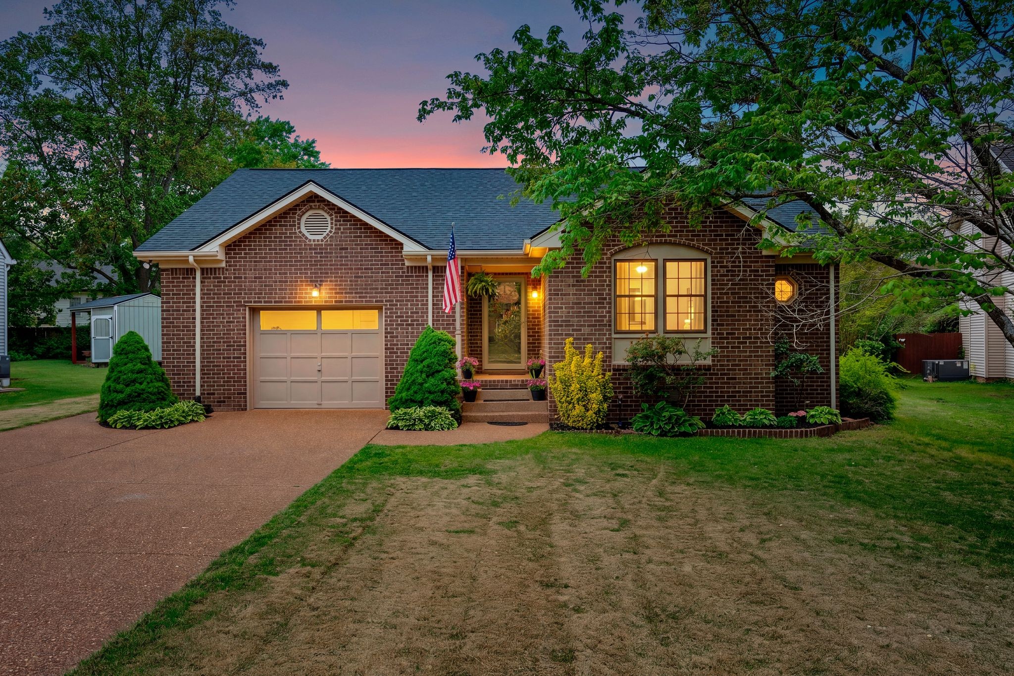 215 Devrow Court Franklin, TN 37064 - Photo 2 of 46 a front view of a house with a yard and garage