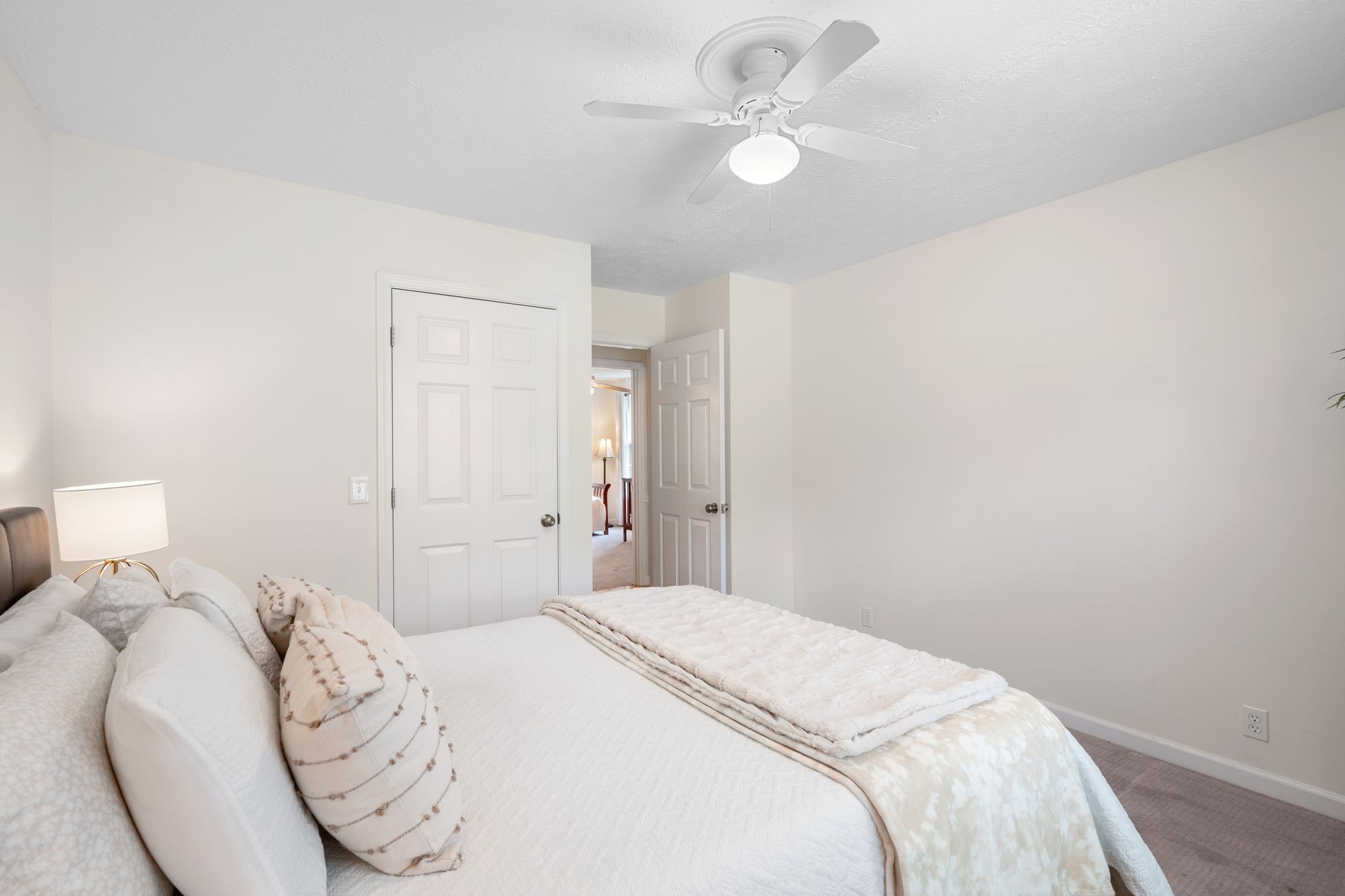 215 Devrow Court Franklin, TN 37064 - Photo 25 of 46 a bedroom with a bed and a chandelier