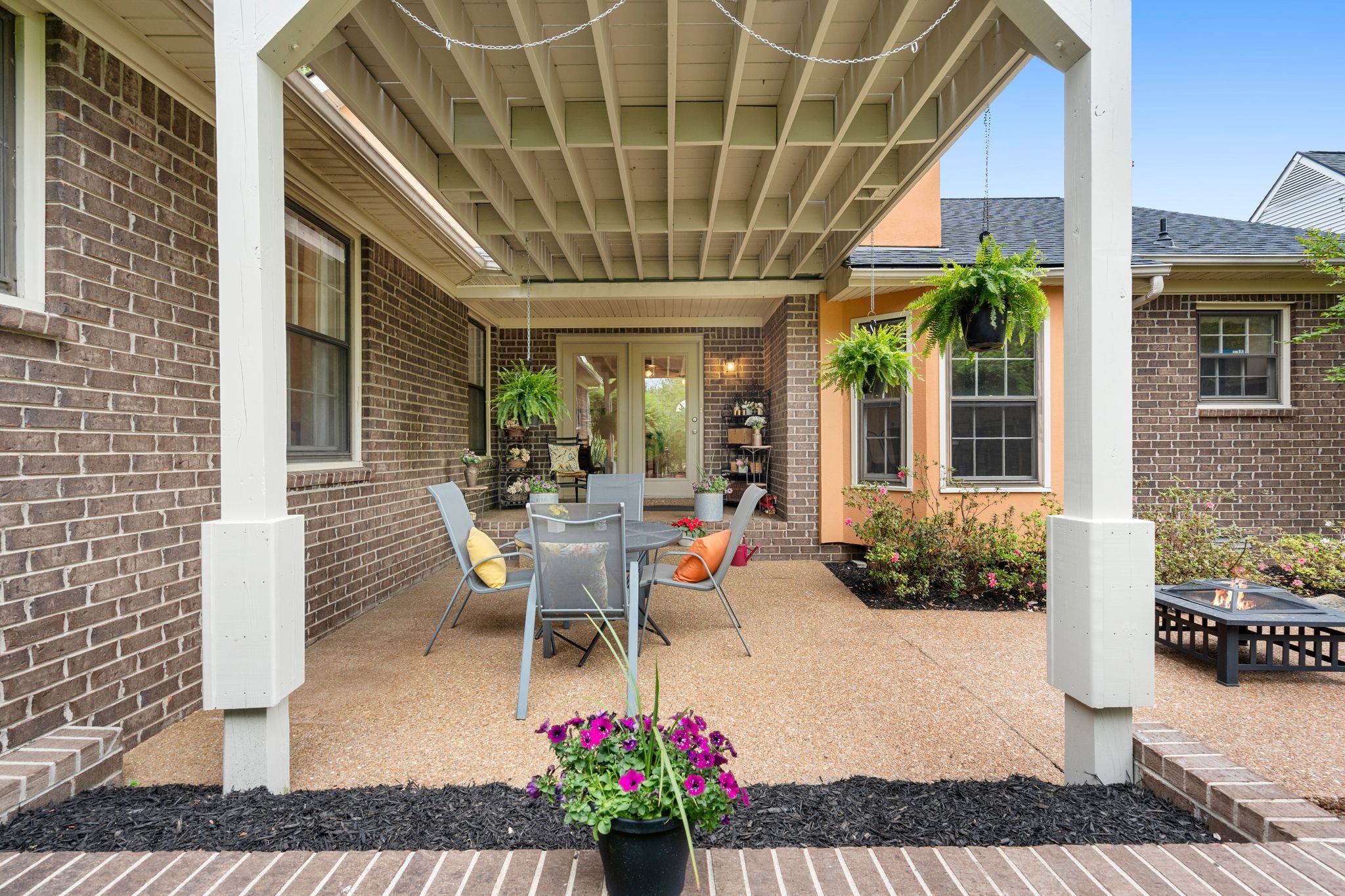 215 Devrow Court Franklin, TN 37064 - Photo 38 of 46 a view of a porch with chairs and potted plants