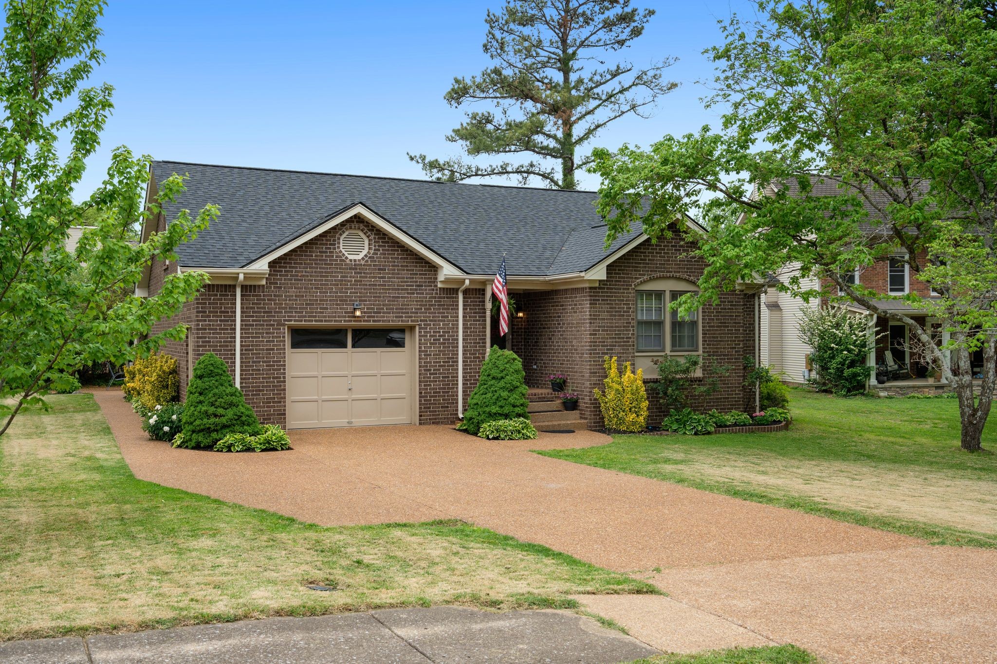 215 Devrow Court Franklin, TN 37064 - Photo 4 of 46 a front view of a house with yard and green space