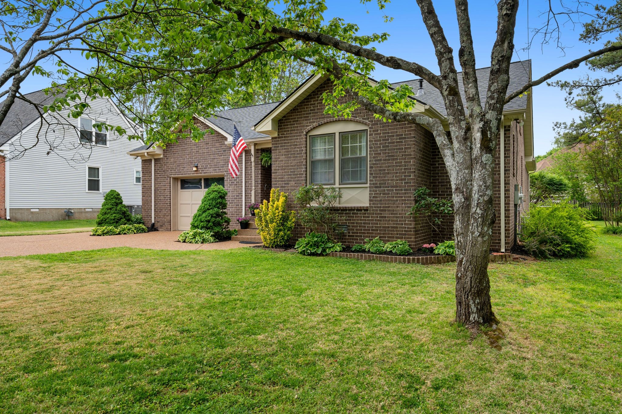 215 Devrow Court Franklin, TN 37064 - Photo 5 of 46 a front view of house with yard and green space