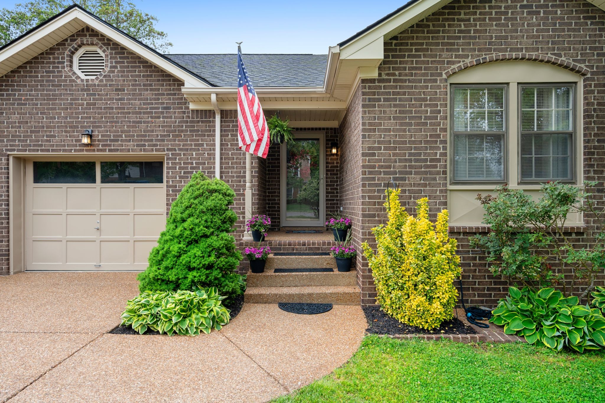 215 Devrow Court Franklin, TN 37064 - Photo 6 of 46 a front view of a house with garden