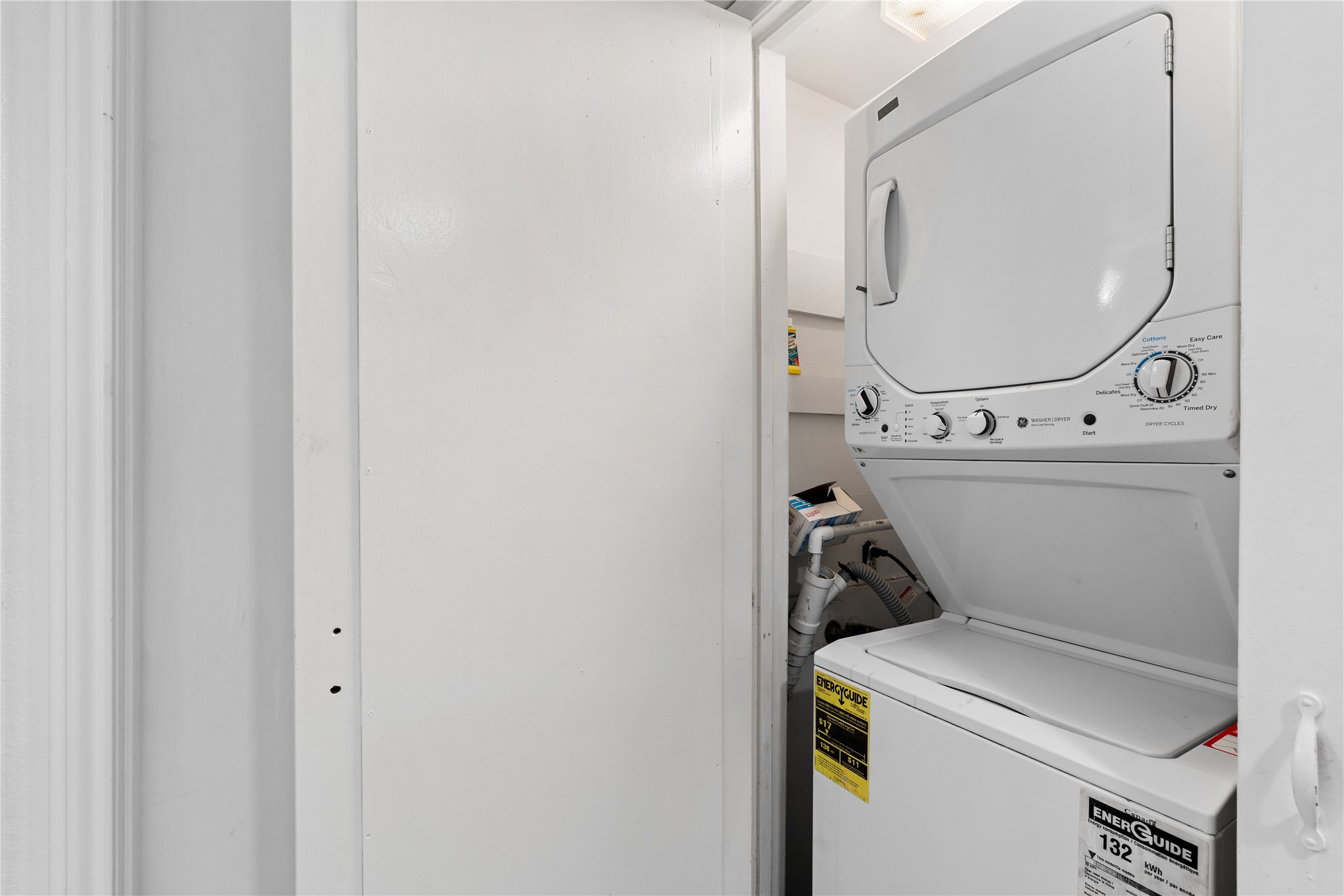 6303 Crab Orchard Road, Unit 3 Houston, TX 77057 - Photo 27 of 30 Even the laundry is upgraded. This dedicated closet houses a high-efficiency stacked washer and dryer set, allowing for full laundry capabilities without sacrificing a single square inch of living space.