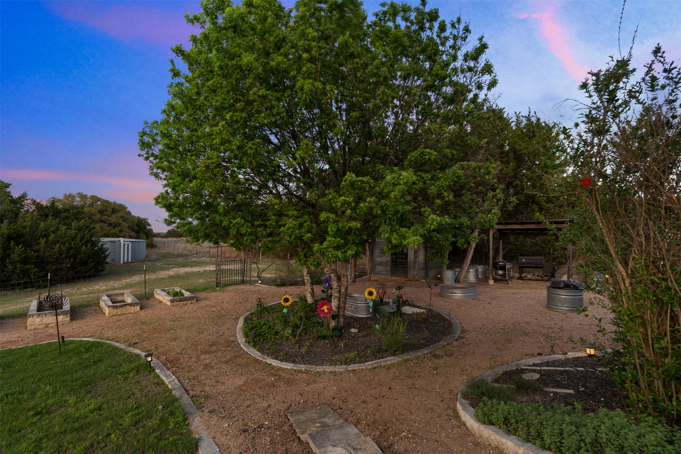 421 Rolling Hills Road Blanco, TX 78606 - Photo 19 of 40 Beautiful garden area next to the primary residence.