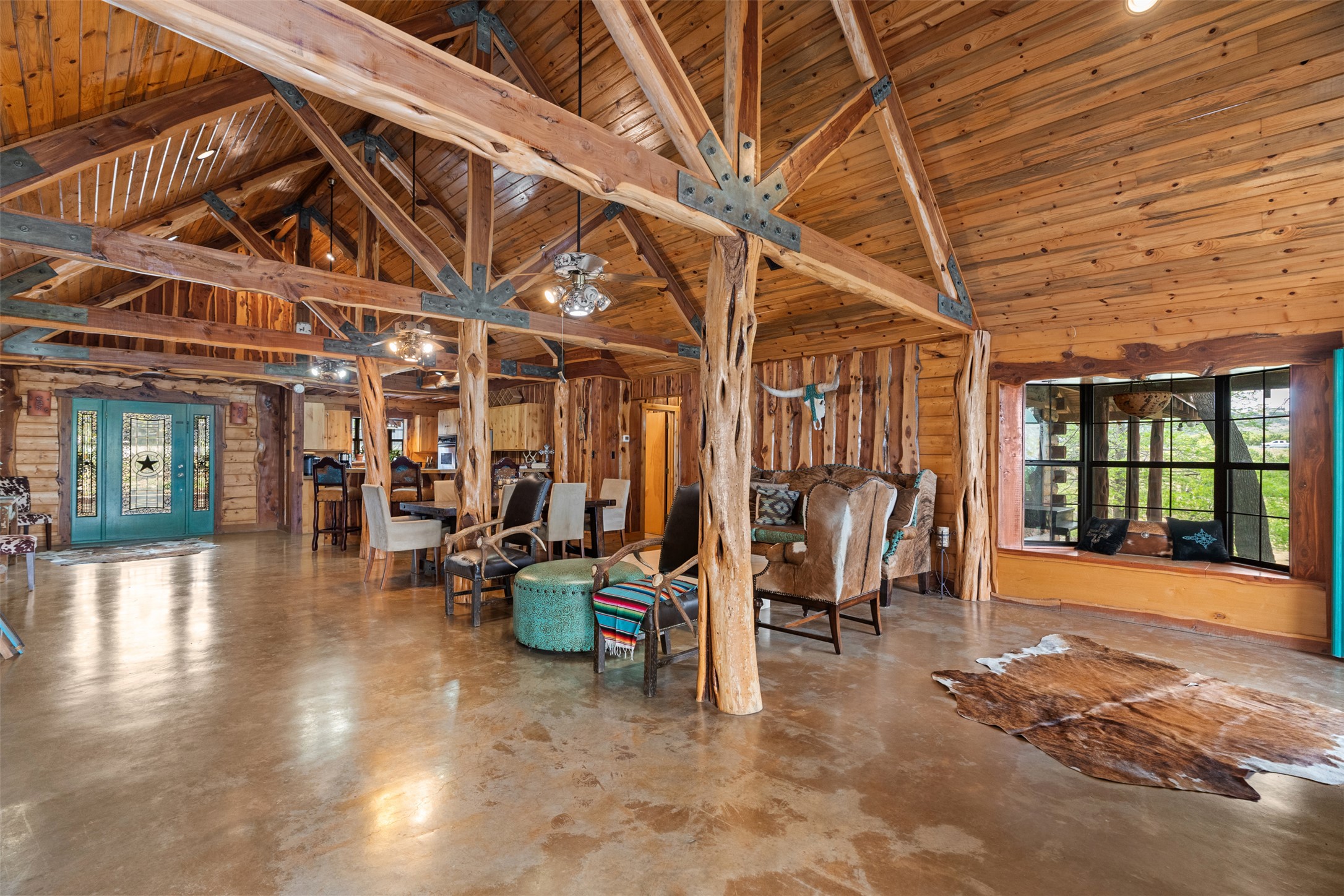 421 Rolling Hills Road Blanco, TX 78606 - Photo 22 of 40 This spacious interior features exposed wood beam ceilings, polished concrete floors, and an open concept perfect for long-term guests or entertaining.