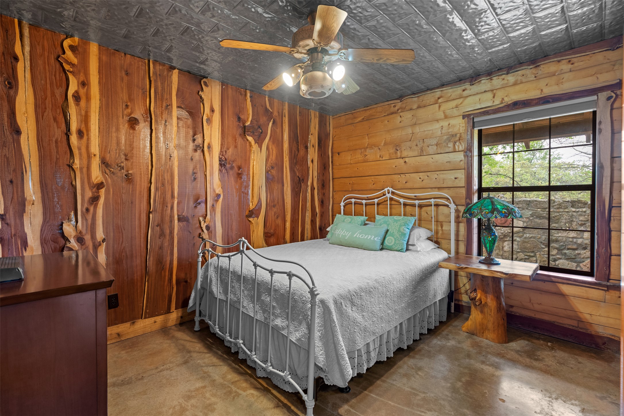421 Rolling Hills Road Blanco, TX 78606 - Photo 26 of 40 This interior room features wood plank walls and a decorative ceiling.