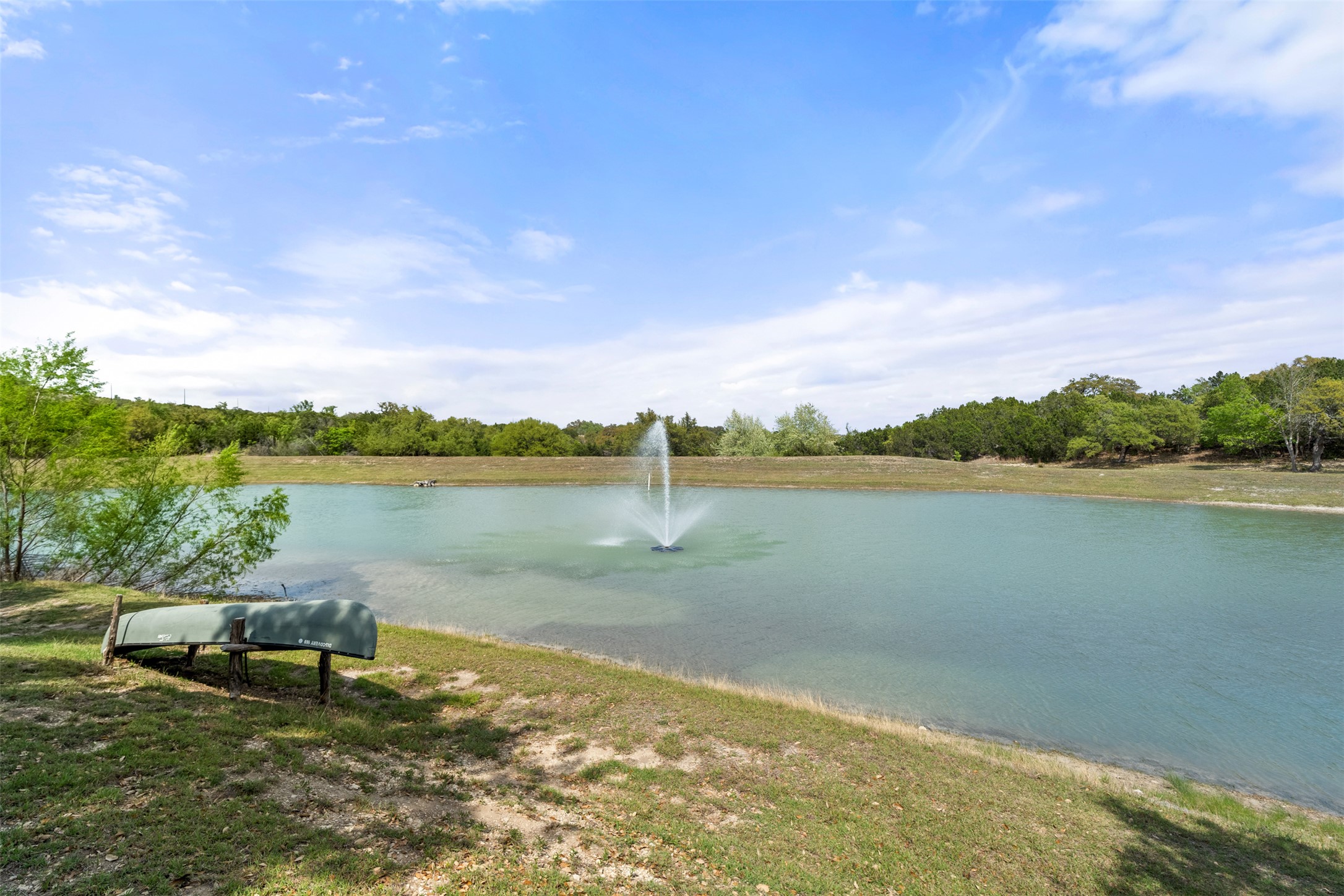 421 Rolling Hills Road Blanco, TX 78606 - Photo 30 of 40 View of the lake from behind the log-cabin.
