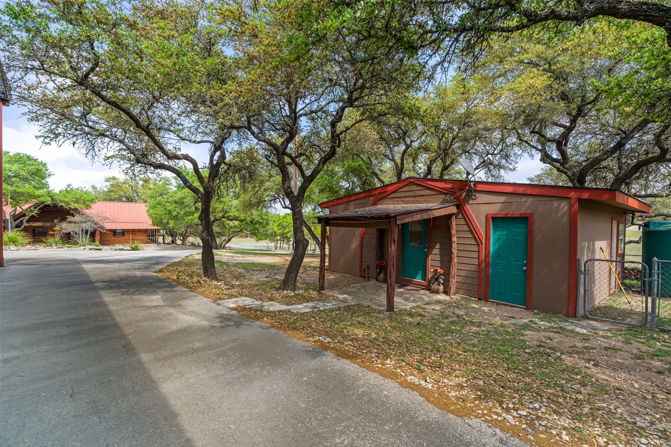 421 Rolling Hills Road Blanco, TX 78606 - Photo 31 of 40 One of two smaller guest homes with bedroom, kitchen and bathroom.