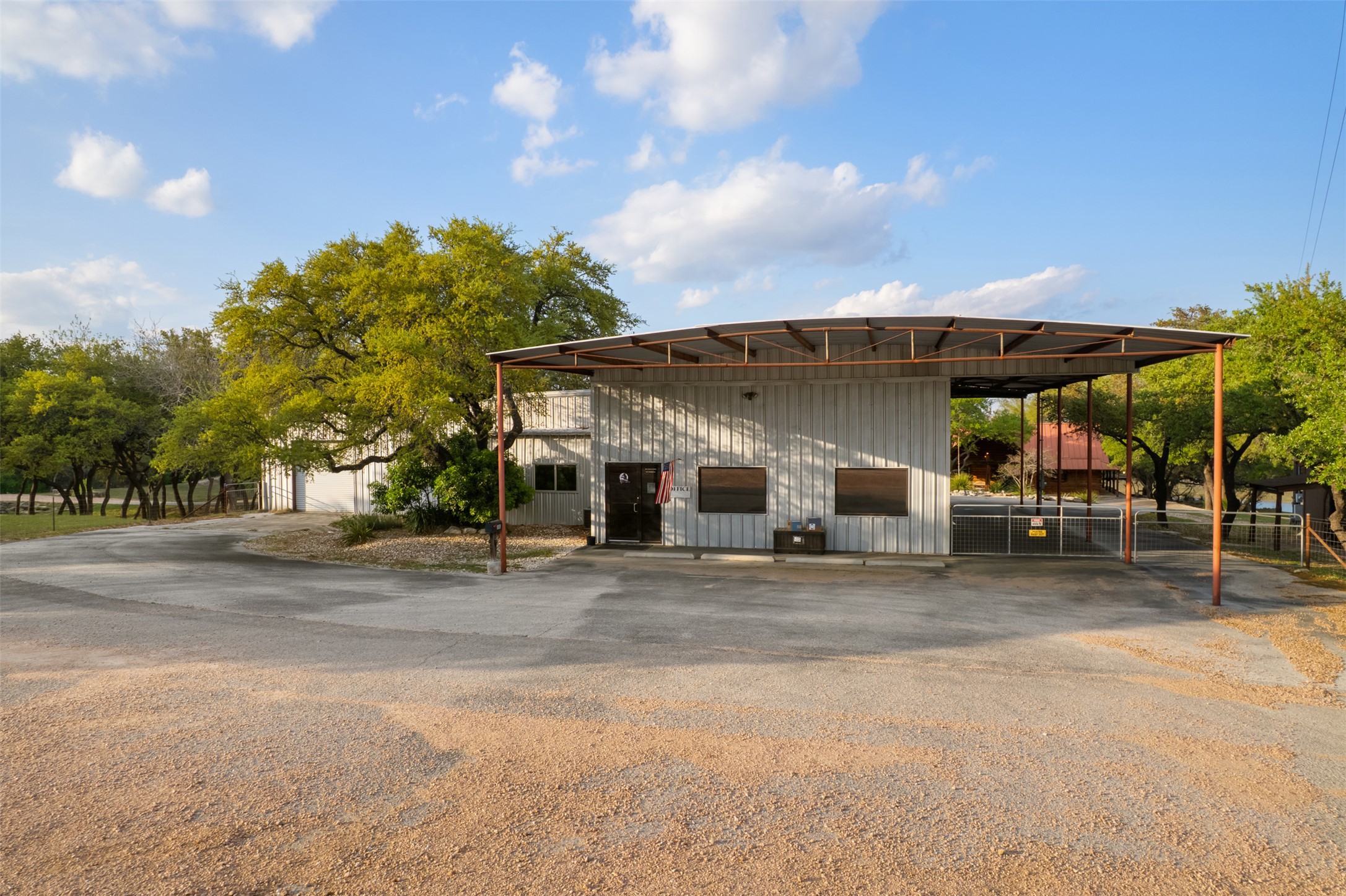 421 Rolling Hills Road Blanco, TX 78606 - Photo 36 of 40 Large workshop with finished out offices, gym, and storage.