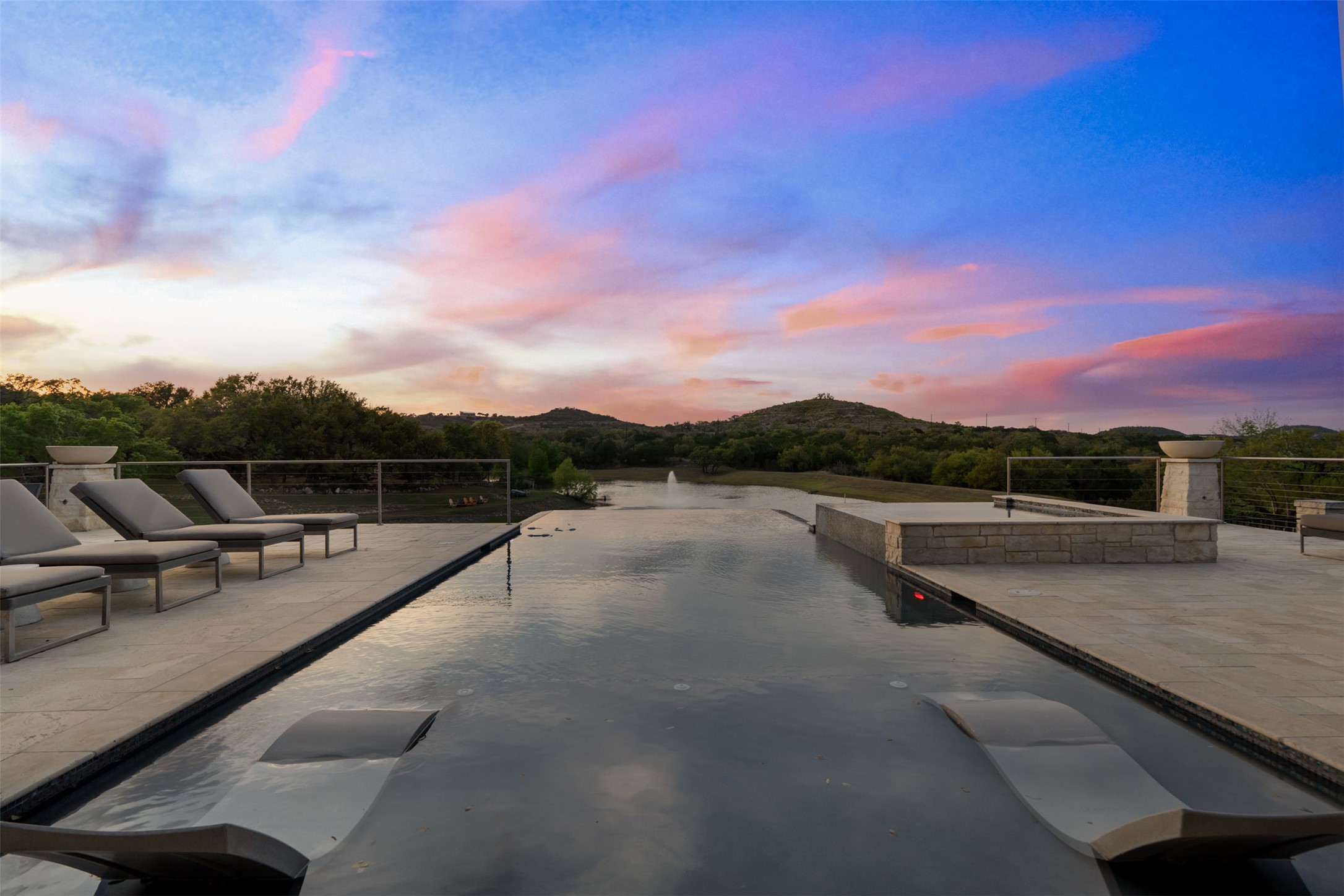 421 Rolling Hills Road Blanco, TX 78606 - Photo 5 of 40 Infinity pool overlooking the private 3 acre lake.