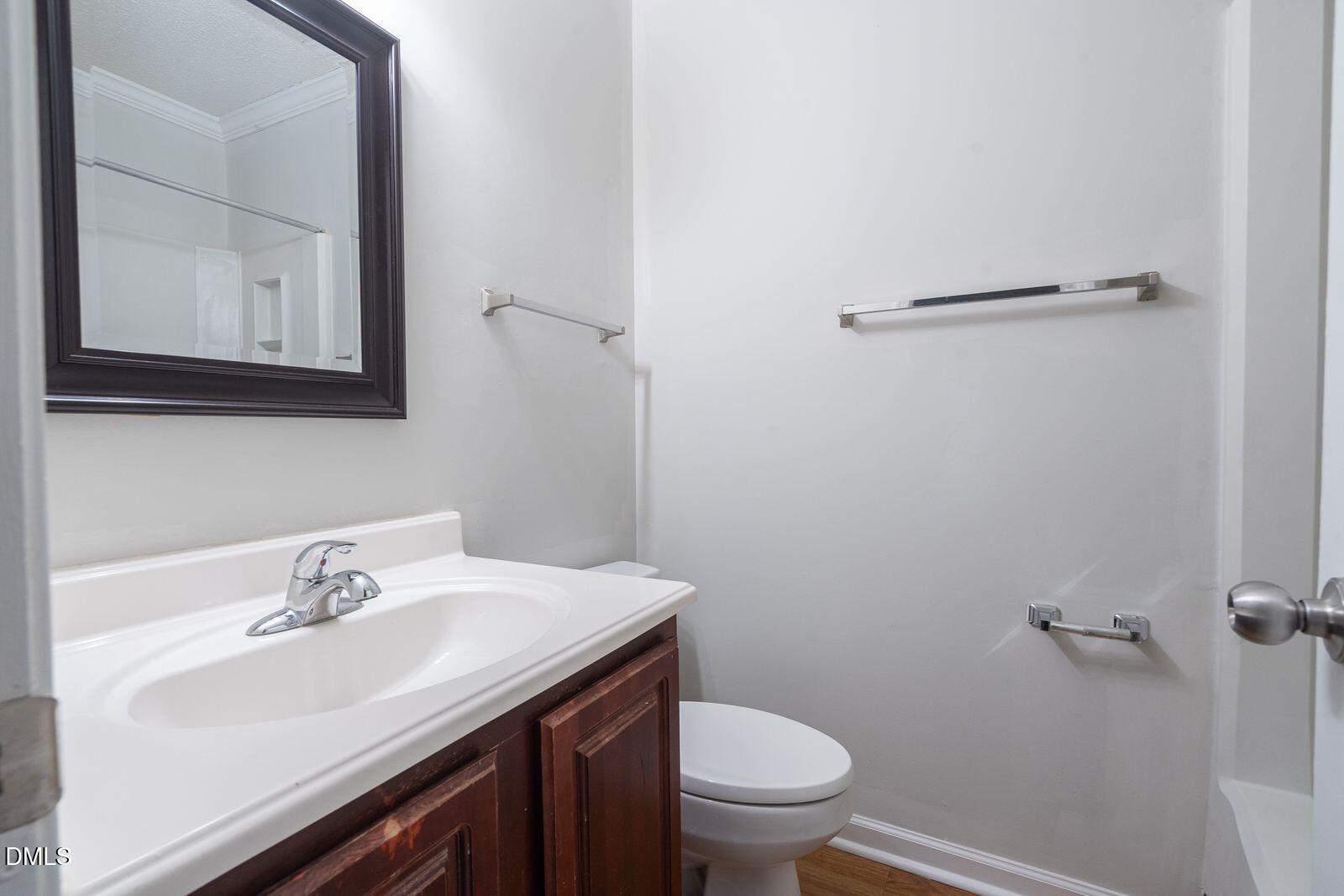 4418 Roller Court Raleigh, NC 27604 - Photo 12 of 13 a bathroom with a sink and a toilet