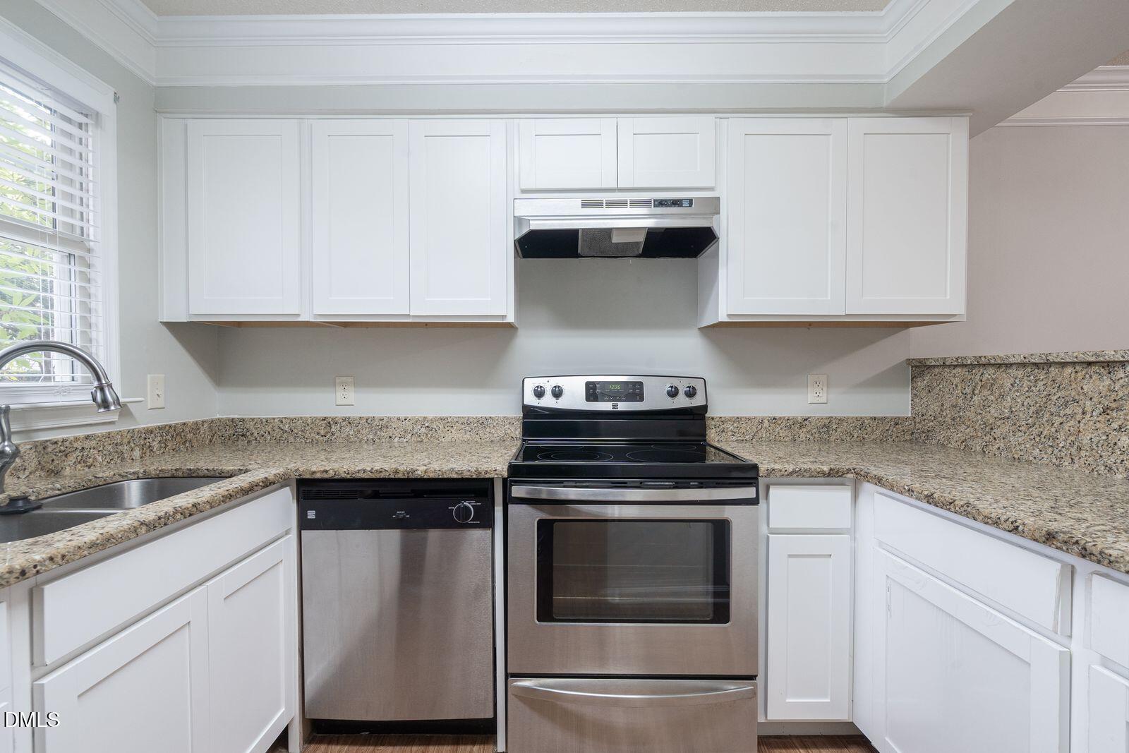 4418 Roller Court Raleigh, NC 27604 - Photo 6 of 13 a kitchen with cabinets appliances and a window