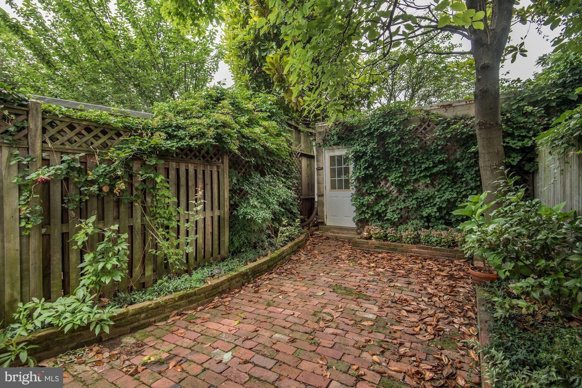 3419 Reservoir Road Northwest Washington, DC 20007 - Photo 23 of 25 Brick garden leading to garage.